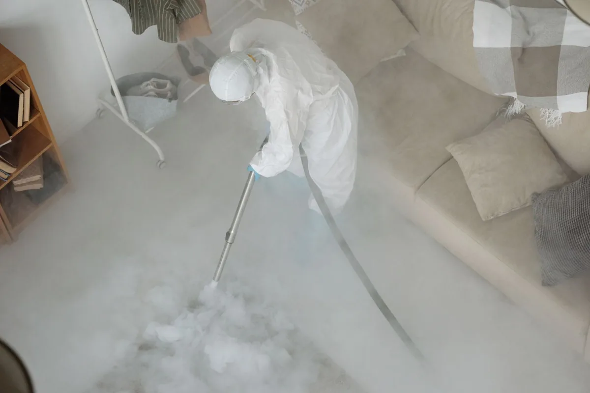 Biohazard cleanup technician in protective equipment, Leetonia, OH